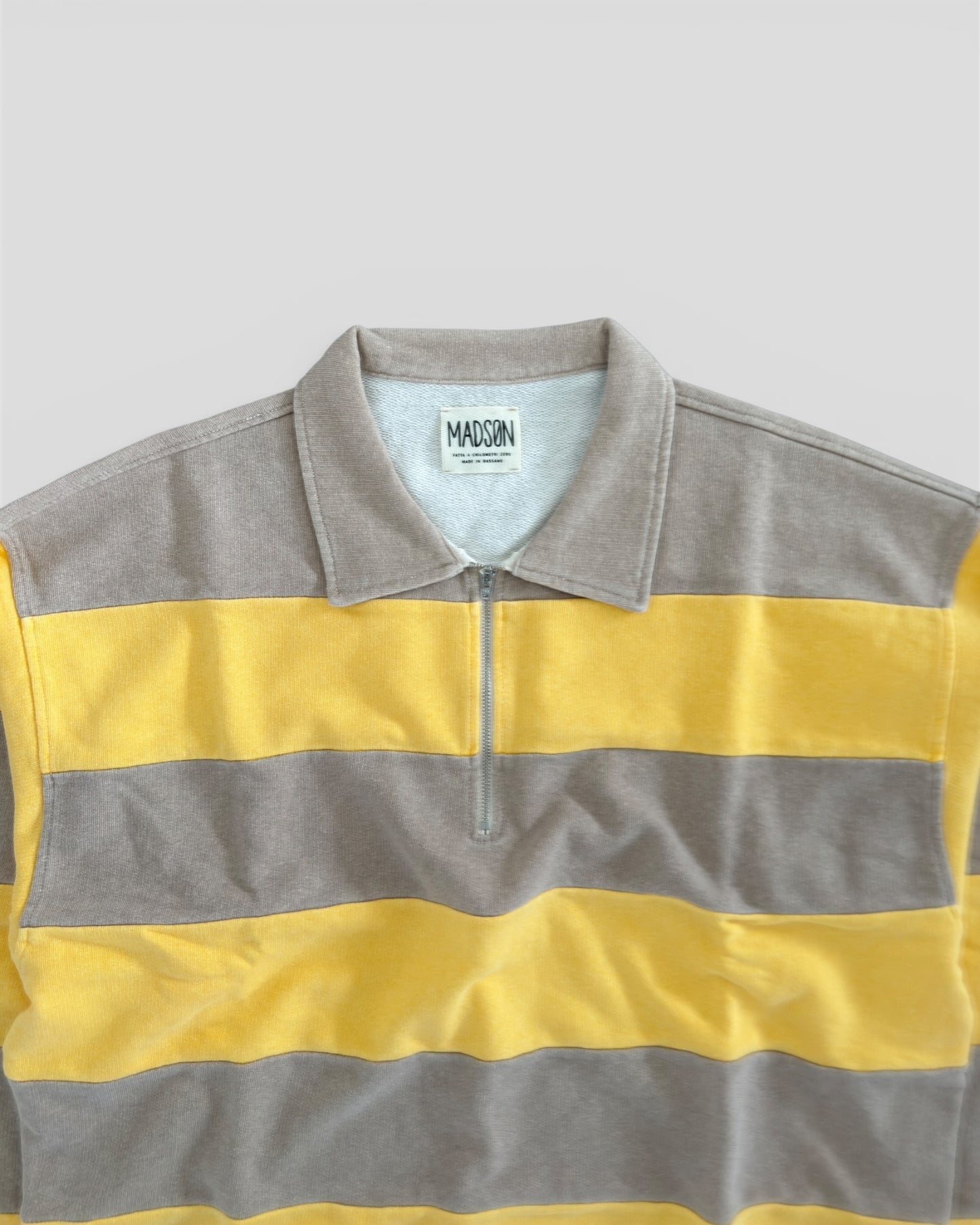 Polo zip riga placcata